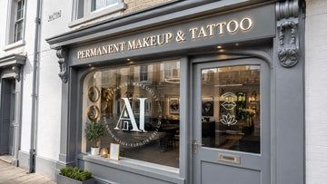 Contemporary UK shopfront with a fascia sign, raised lettering and branded window graphics
